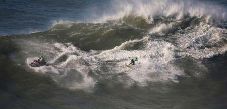 NAZARE, PORTUGAL - NOVEMBER 23 : Team Hugo Vau /CJ Macias in North Canyon Tow In Trials Round 1 November 23, 2011 in Nazare, Portugalのeditorial素材