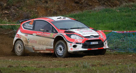 ALGARVE, PORTUGAL - MARCH 31: Maciej Oleksowicx (POL) driving is Ford Fiesta S2000 in Rally de Portugal 2012 on March 31, 2012 in Algarve, Portugalのeditorial素材