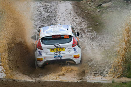 ALGARVE, PORTUGAL - MARCH 31: John Maccrone (GRB) driving is Ford Fiesta R2 in Rally de Portugal 2012 on March 31, 2012 in Algarve, Portugalのeditorial素材