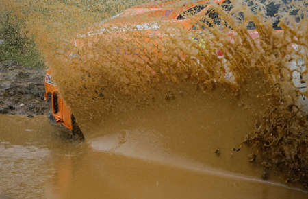 Rally car in muddy water splashのeditorial素材