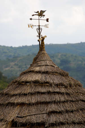 old weather vane in straw shackの写真素材