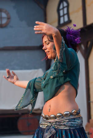 OBIDOS, PORTUGAL - JULY 26: Belly dancer performing in  Medieval Market of Obidos 2012 July 26, 2012 in Obidos, Portugal のeditorial素材