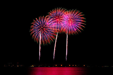 Colorful fireworks display against a dark night sky.の写真素材
