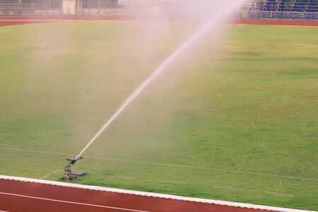 Watering the football fieldの写真素材