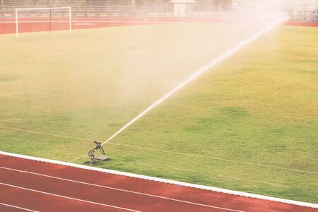 Watering the football fieldの写真素材