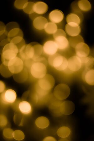 Bokeh light gold defocus at night abstract background.の写真素材