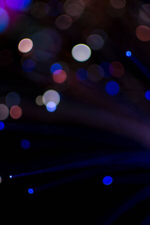 Colorful bokeh light celebrate at night, defocus light abstract background.の写真素材