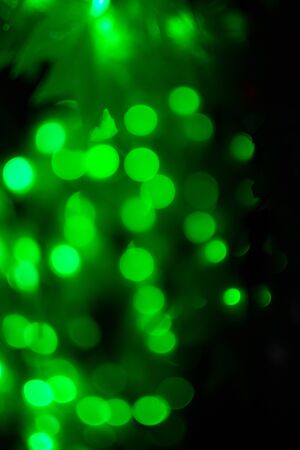 Bokeh light green defocus at night abstract background.の写真素材