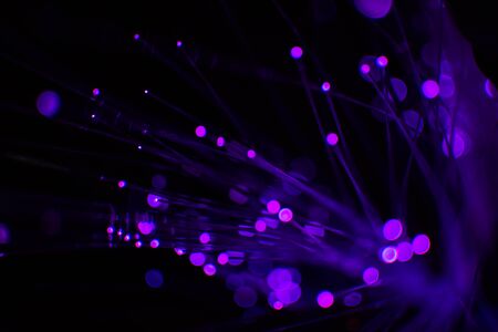 Purple bokeh light celebrate at night, defocus light abstract background.の写真素材