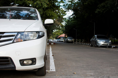 White car parked on the street.の写真素材