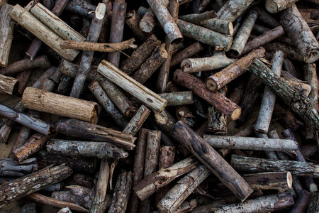 Wood cut into pieces, firewood background.