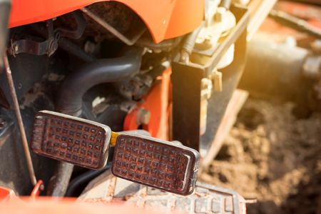 Brake and accelerator pedal for tractor. Worker foot.の写真素材