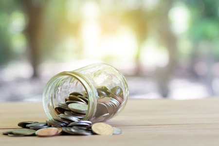 Coins on wooden with softlight. Saving money and account growth business concept. Coin thai baht.の写真素材