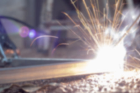 Technician focus on welding process on spark light with equipment.の写真素材