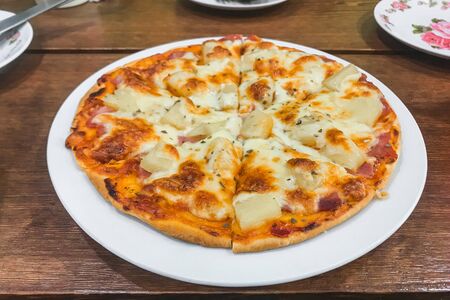 Appetizing gingerbread pizza  Italian cuisine. top view. vertically closeup.の写真素材