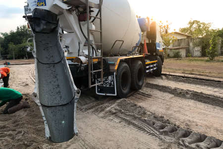 Workers pouring reinforced concrete floors on siteの写真素材