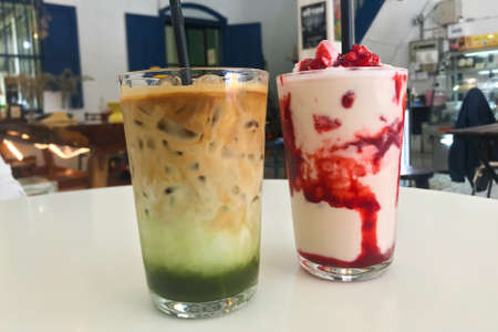 Green Tea and Strawberry Smoothie Dessert in the storeの写真素材