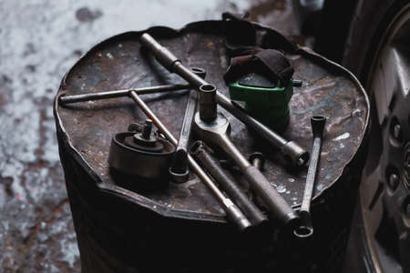 The mechanic is checking the undercarriage of the car.の写真素材