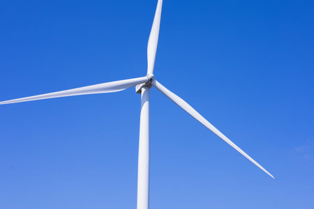 Offshore wind power and energy farm with many wind turbines on the mountainの写真素材