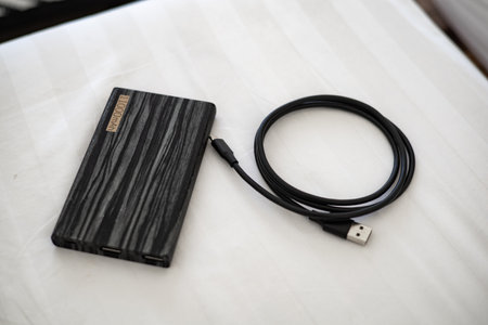 Power bank with charging cable ready to use.の写真素材