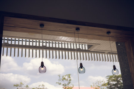 Lamp hanging in front of a coffee shop for decorationの写真素材