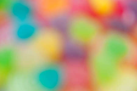 Colorful mix jelly fruits on abstract background blurの写真素材
