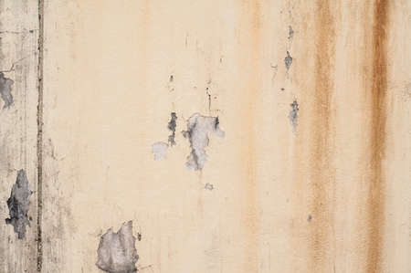 Old wall texture with peeling paintの写真素材