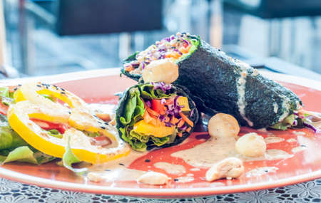 Vegetarian food, Vegetables wrapped in seaweed with sauceの写真素材