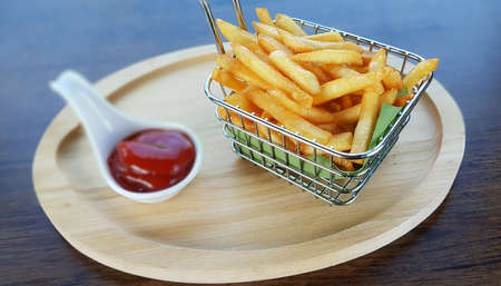 French fries in basket served with ketchupの写真素材