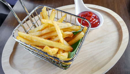 French fries in basket served with ketchupの写真素材