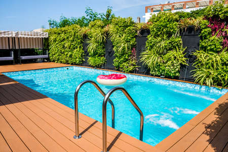Modern swimming pool in the gardenの写真素材