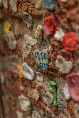 Bubble gum stuck on wallの写真素材