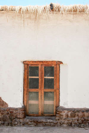 white house with brown windowの写真素材