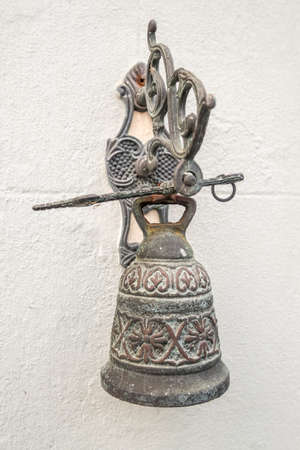 metal bell on wallの写真素材