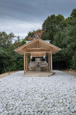 Small buddhist shrine in Satoyama with a gravel walkwayの写真素材