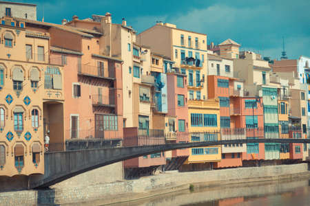 A river view of local houses in Girona, Spainの写真素材