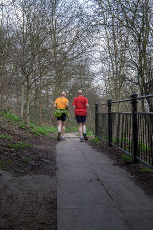 Two man jugging in the park, Londonの写真素材