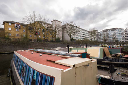 London Canal with boats overlooking flatsの写真素材