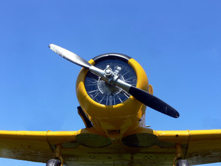 yellow airplane from world war 2 on blue sky