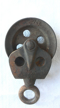 old rusty pulley on white 