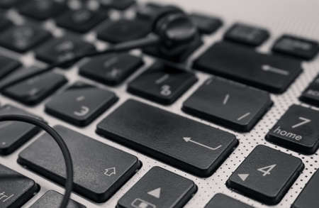 Headphones at The rectangular Computer enter keyの写真素材