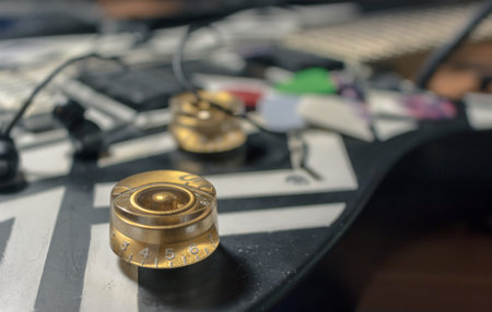 The volume controls and tone of an electric guitar
