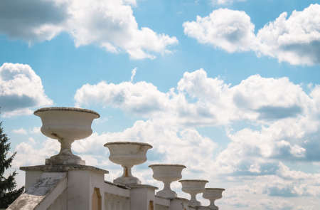 Sculpture on a background of blue sky with large white cloudsの写真素材