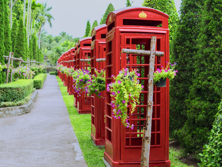 Red Thai Phone Booths in Nong Nooch Garden.の写真素材