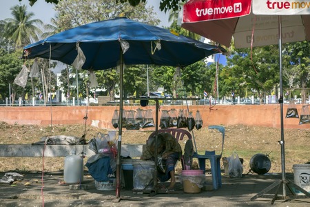 Live Fish Seller and Sleeping Dog near Nan River in Phitsanulok of Thailand EDITORIAL
Phitsanulok, Thailand - February 2, 2015: Live Fish Seller and Sleeping Dogのeditorial素材