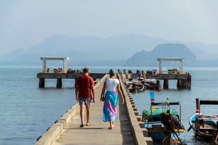 Adult Couple Walking on Pier of Koh Mook Island Thailand - January 22, 2015のeditorial素材