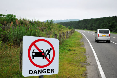 Danger sign at road sideの写真素材