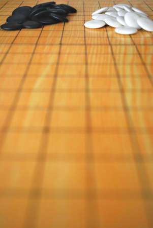 Chinese Go board with black and white piecesの写真素材