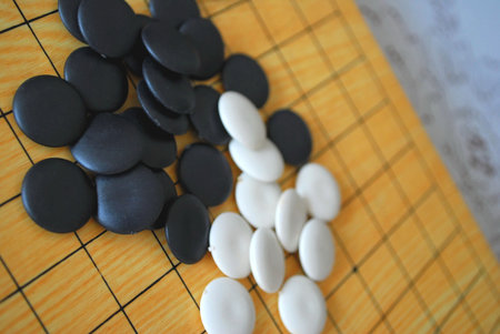 Chinese Go board with black and white pieces