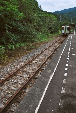 Track leading to train at station